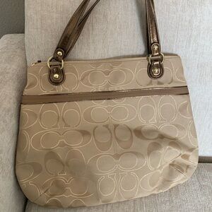Gold Coach bag with coral
